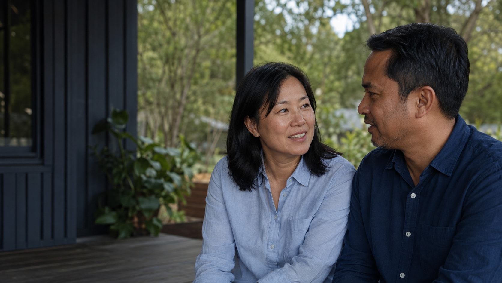 Illustrative photograph of two adults sharing a relaxed moment on an Australian home veranda.